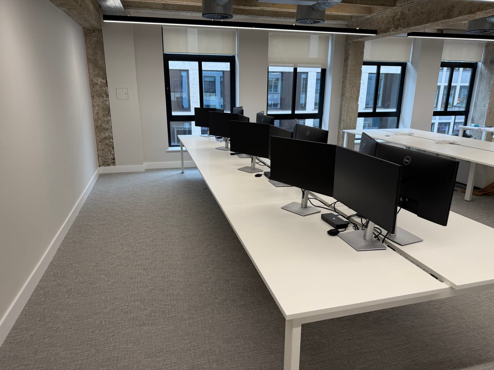 Desk equipment installed across the office.