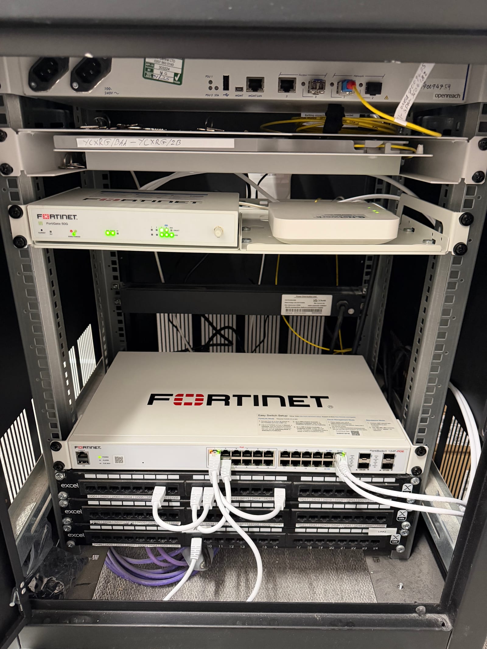 Fortinet equipment and patch connections in the fitted cabinet.