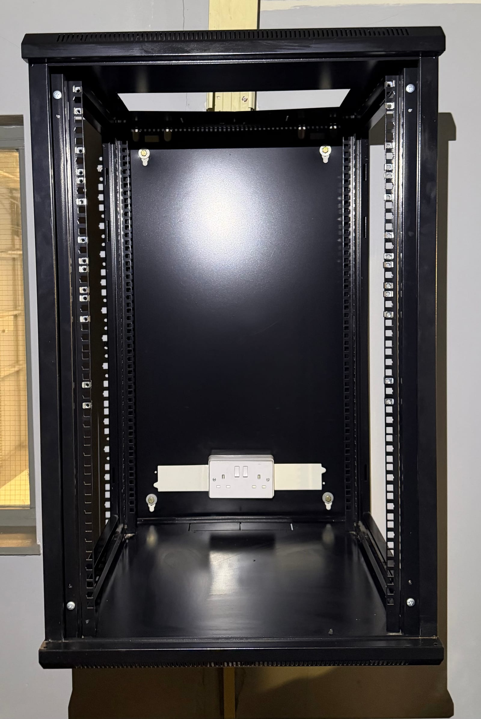 The new cabinet prepared for the cabling.