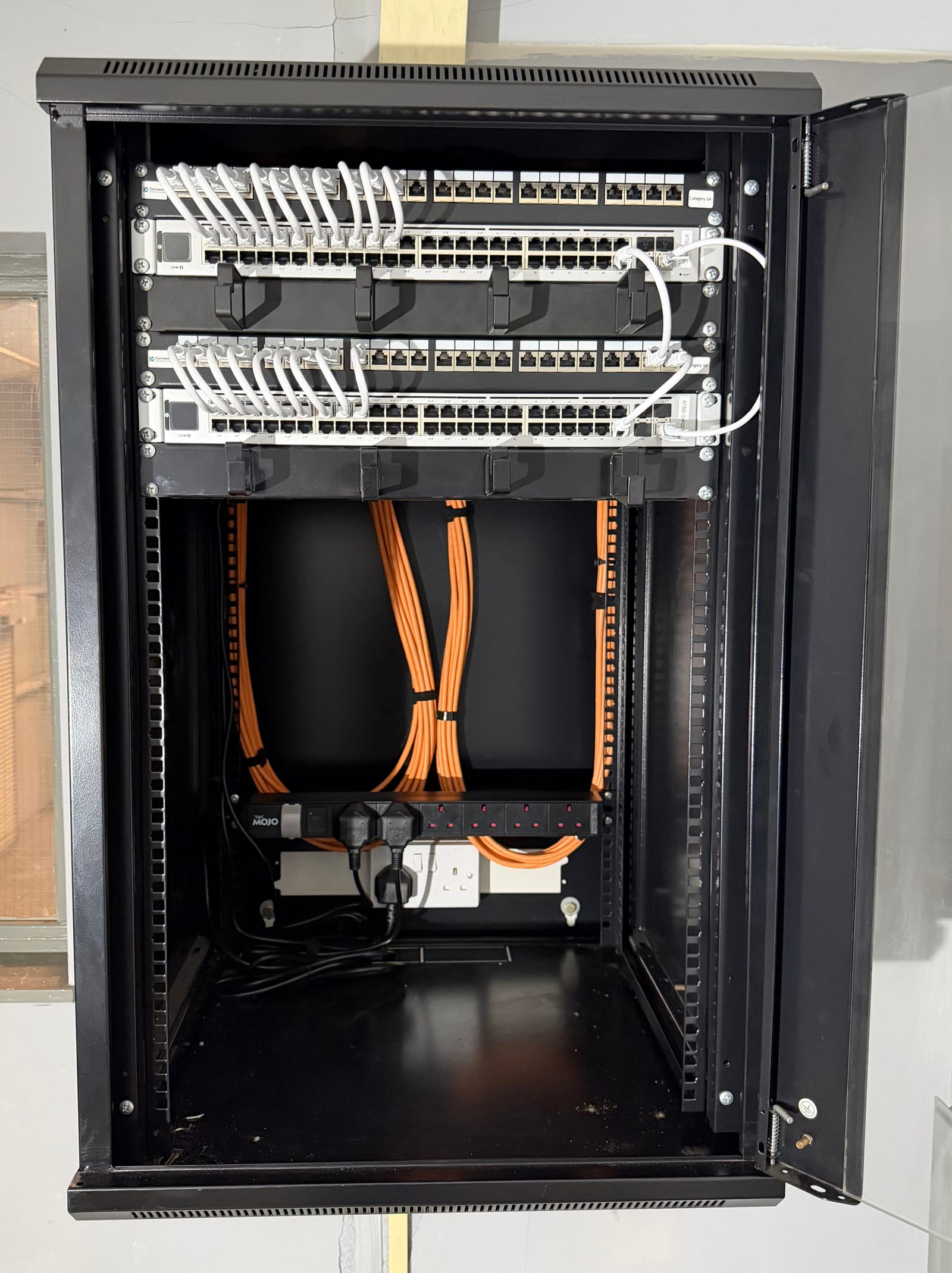 The cabinet after termination and patching.