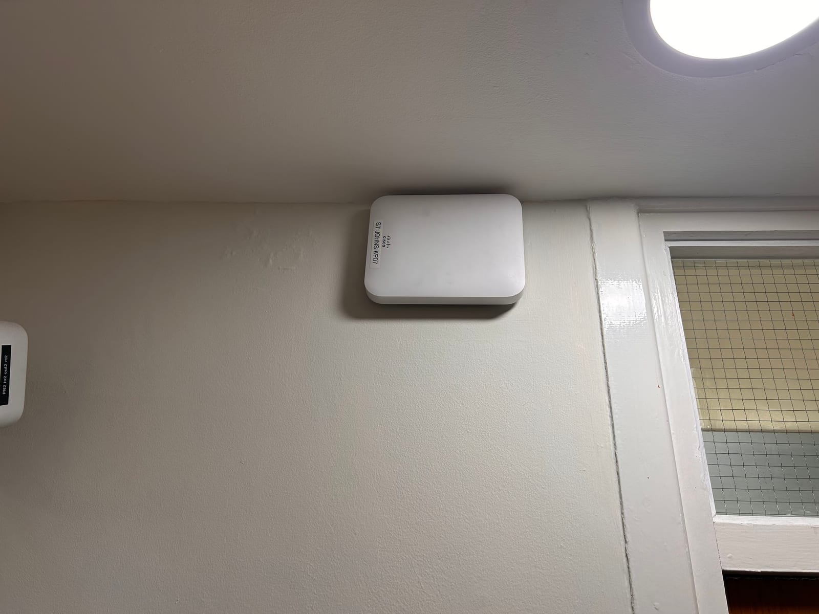 The original Meraki access point before replacement.
