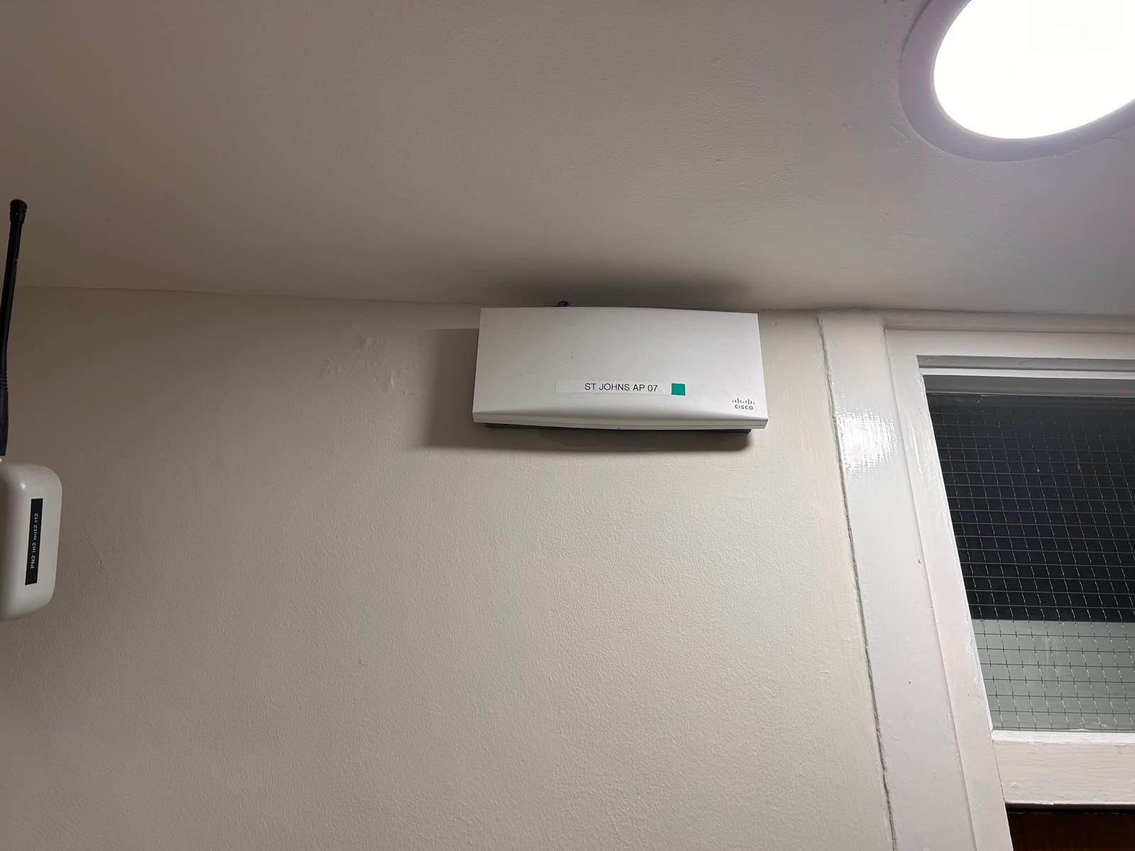 The replacement access point installed in place of the older unit.