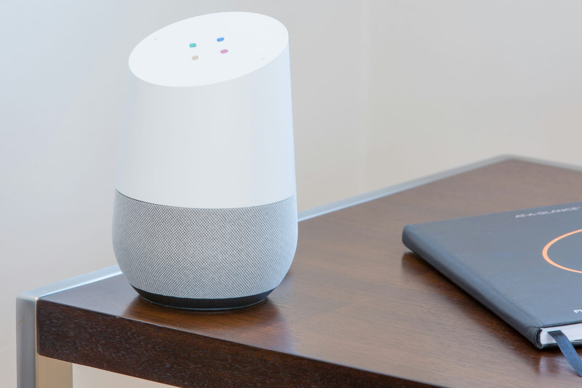 A connected smart speaker on a side table at home